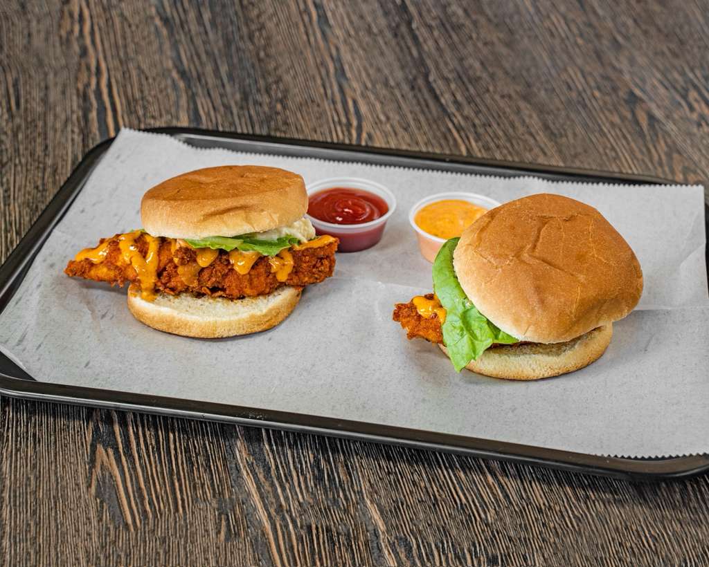 Two crispy chicken sandwiches on a tray