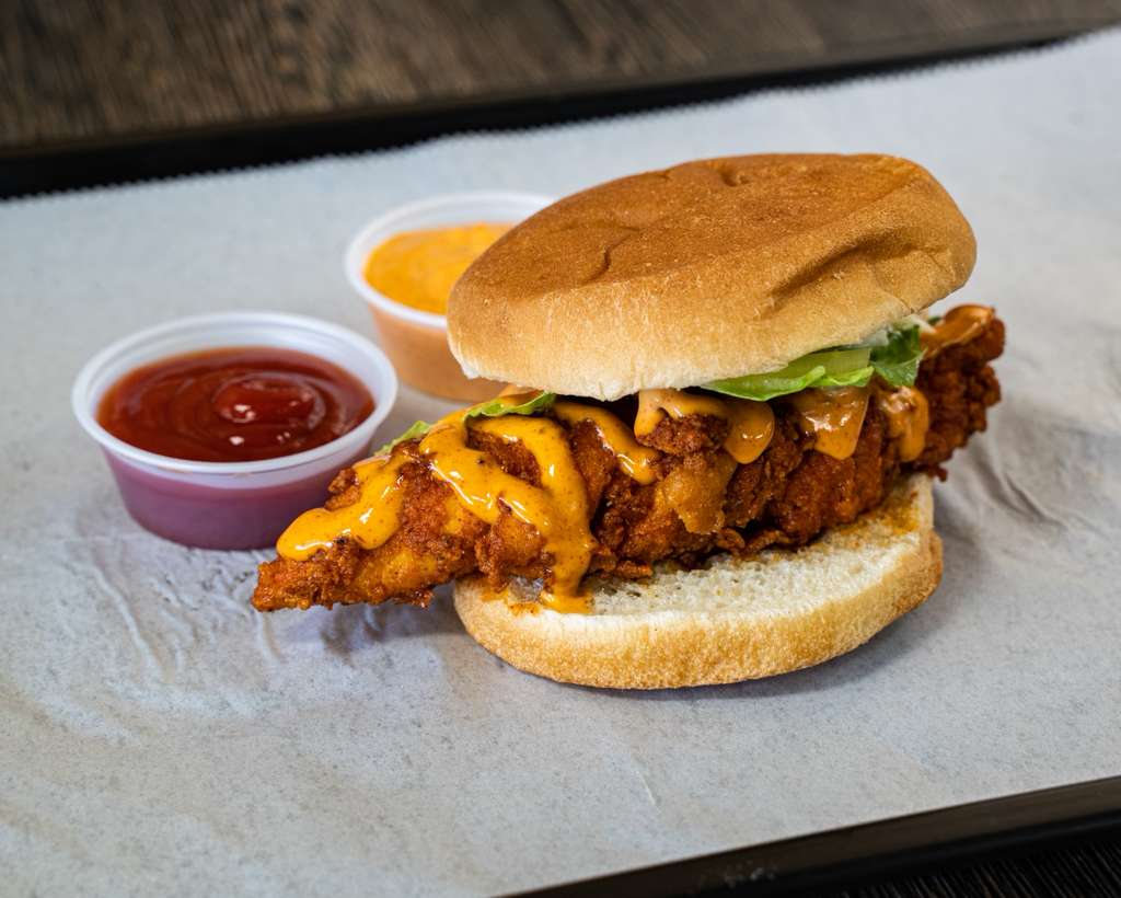 Zinger chicken burger with sauce dripping